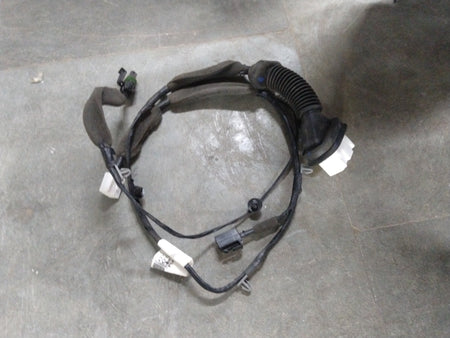 Front left door harness wire for Chevrolet Beat by General Motors, showing electrical connectors and wiring inside the door panel.