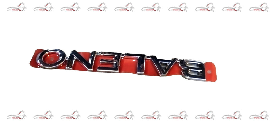 Maruti CarTrends Emblem Baleno 77831M68P000PG front view, close-up of chrome emblem on a Maruti Suzuki Baleno car