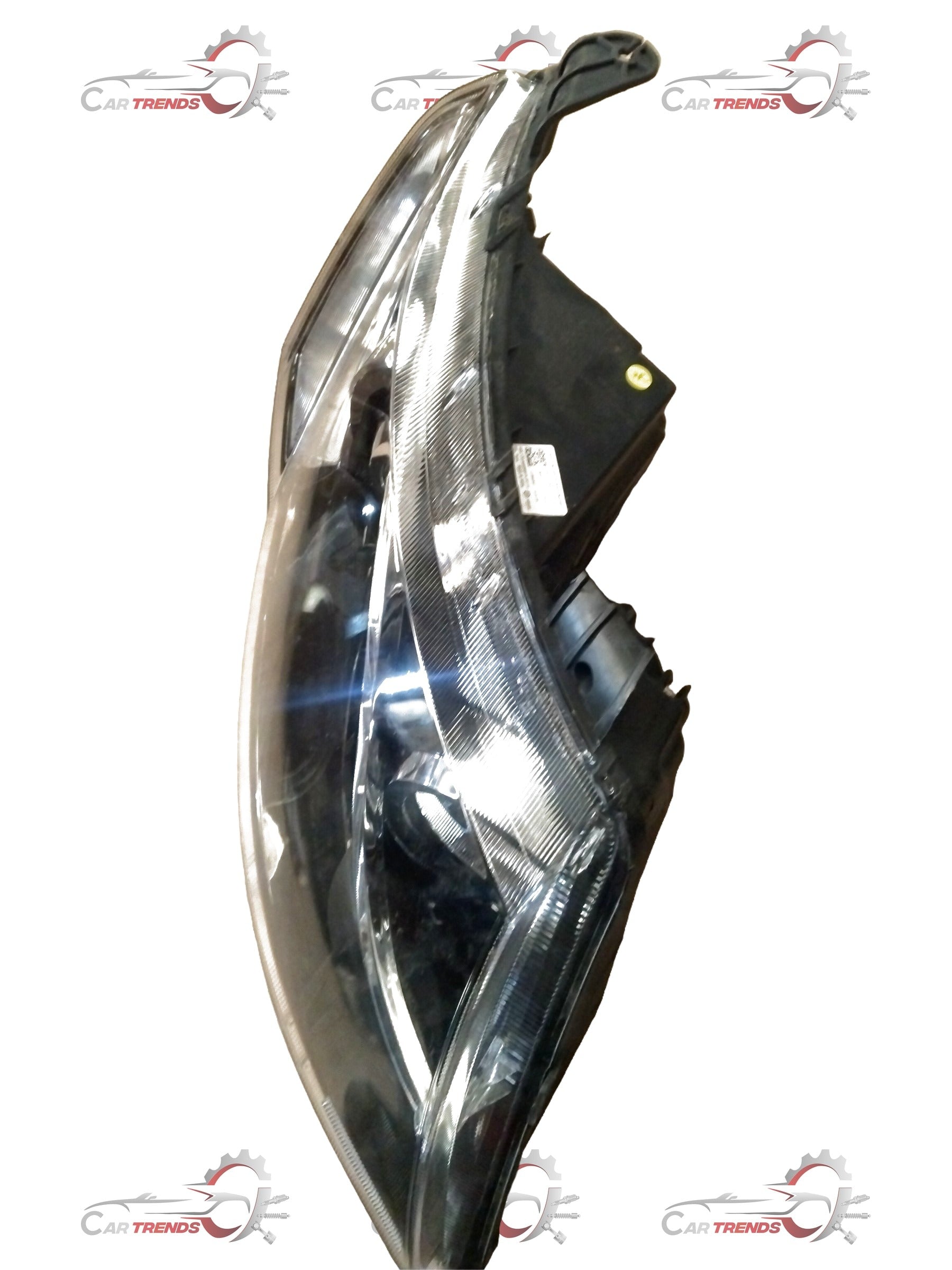 Mahindra XUV 500 right headlamp showing the black housing and clear lens for vehicle front lighting.