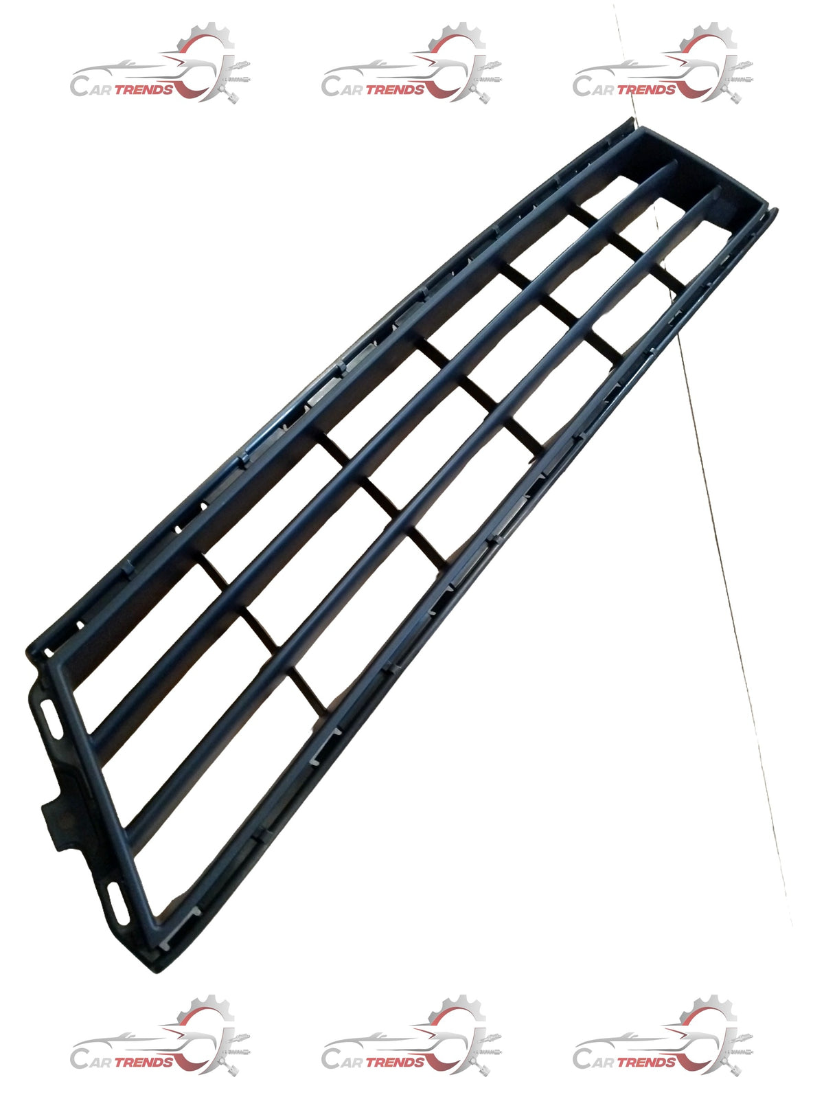 Maruti Suzuki Ertiga radiator grille with chrome accents, front view showing the grille's design and mounting points.