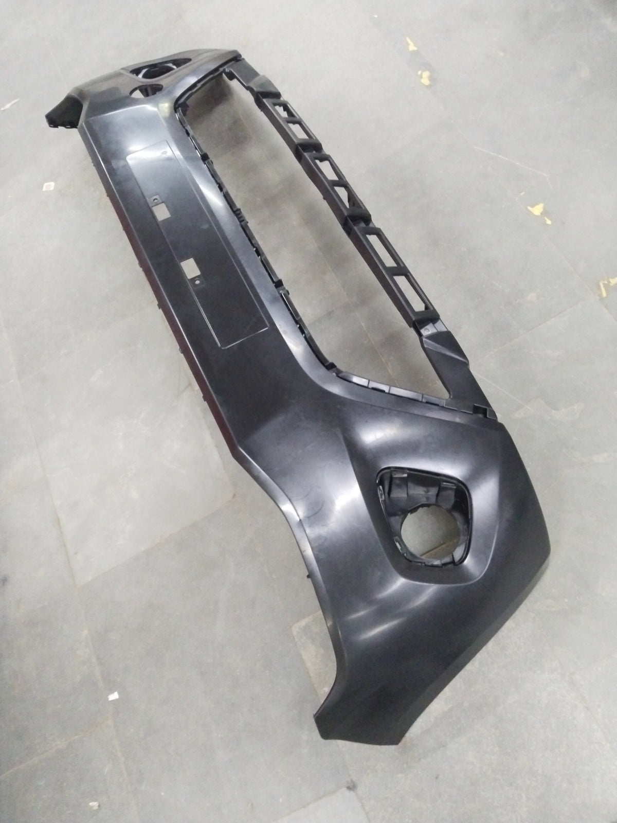 Maruti Suzuki front bumper for WagonR 3rd Gen and Celerio 2nd Gen petrol/CNG models, shown in a close-up view.
