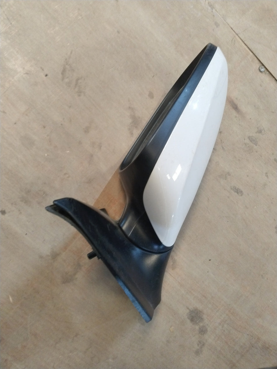 Hyundai Verna Fluidic mirror LH side, sleek design with reflective glass and black frame, mounted on vehicle door.
