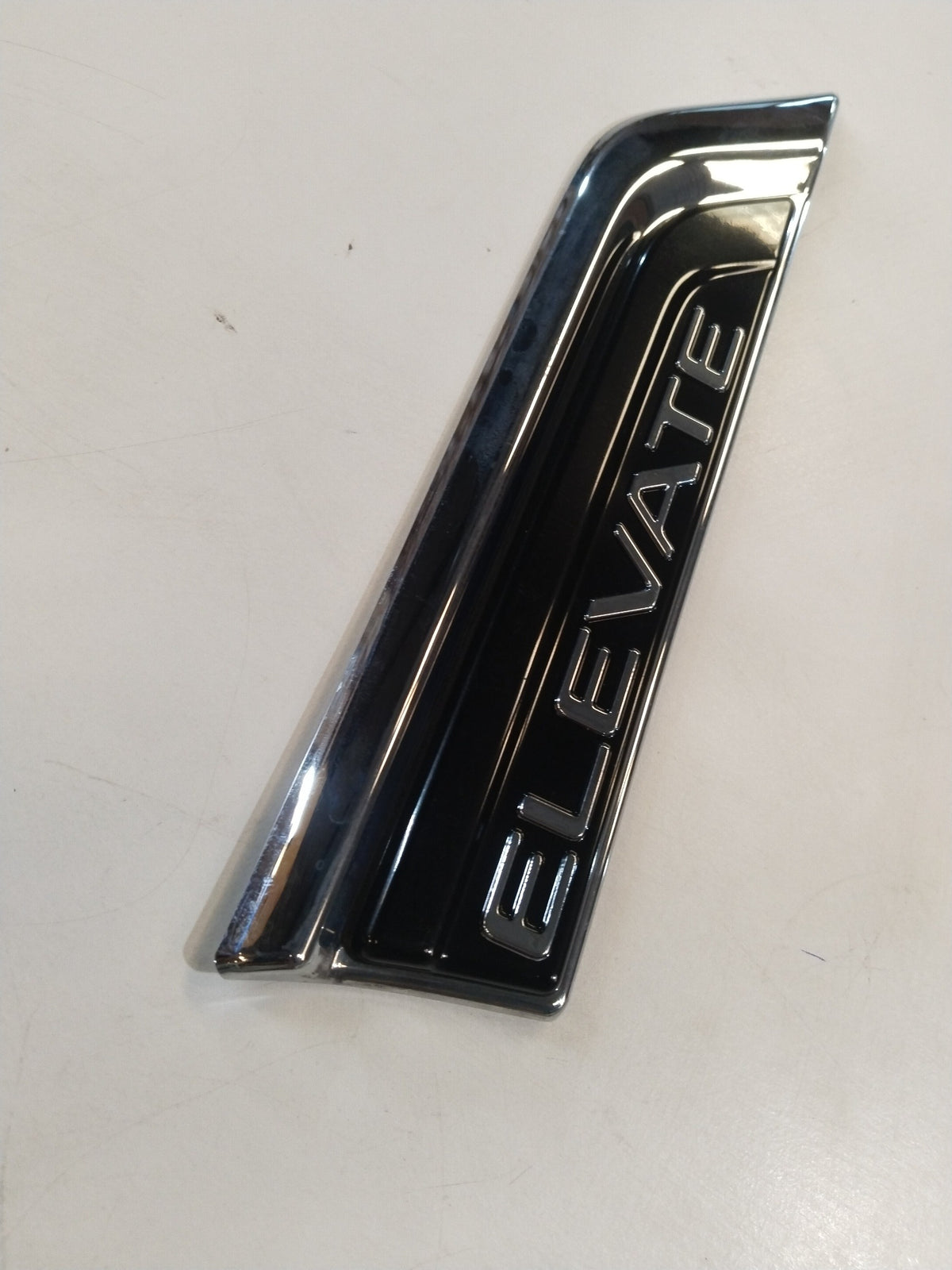 Honda Mobilio fender garnish kit in black, showing close-up of the sleek, molded plastic fender trim for vehicle enhancement.