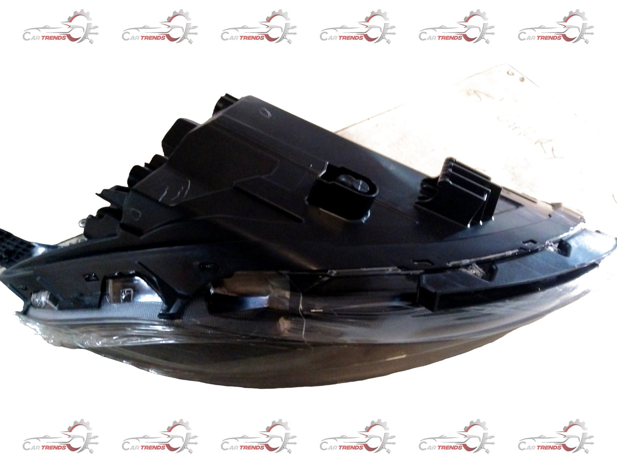 CarTrends I10 Grand Nios headlamp spare part, left-hand side, close-up view showing lens and housing component.