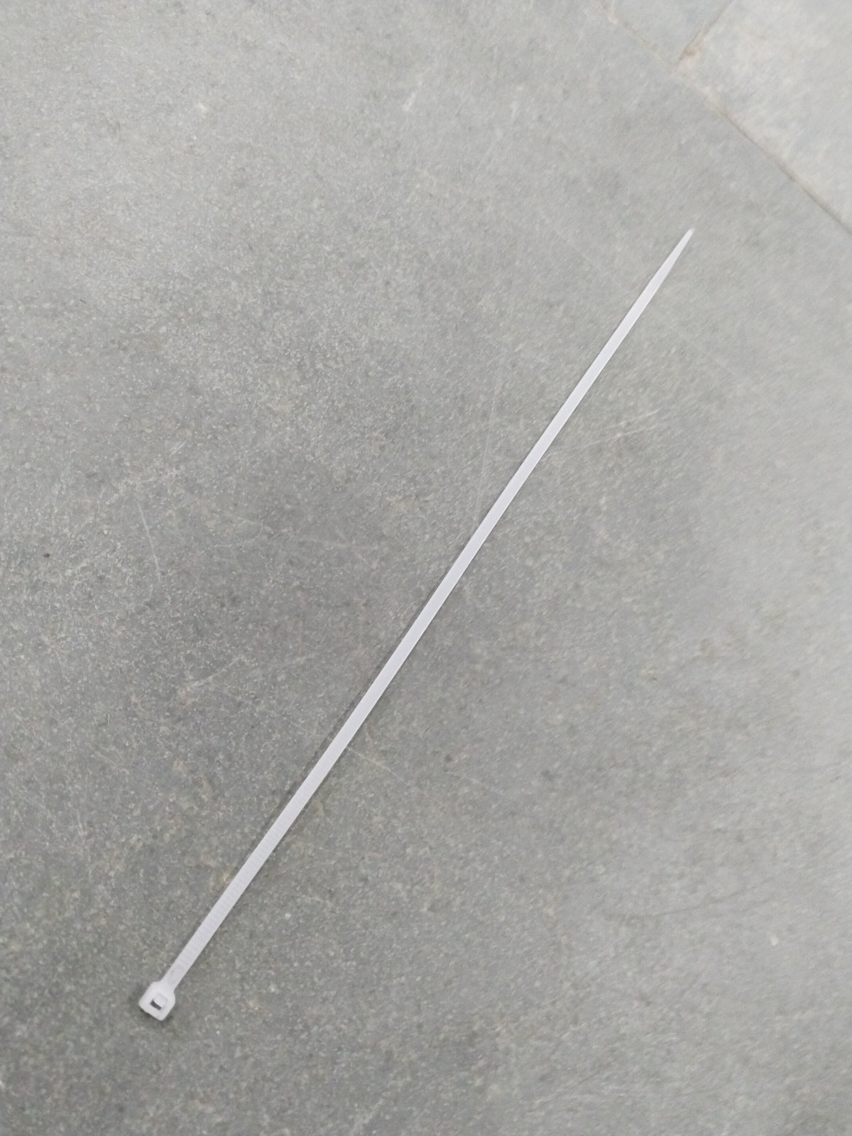 Aftermarket tie clip with 250*3 design, metal finish, and sleek style, suitable for formal or professional attire.