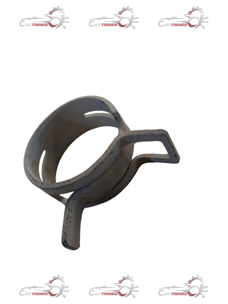 Maruti Suzuki Alto radiator hose clip showing metal fastener with attached rubber hose component.