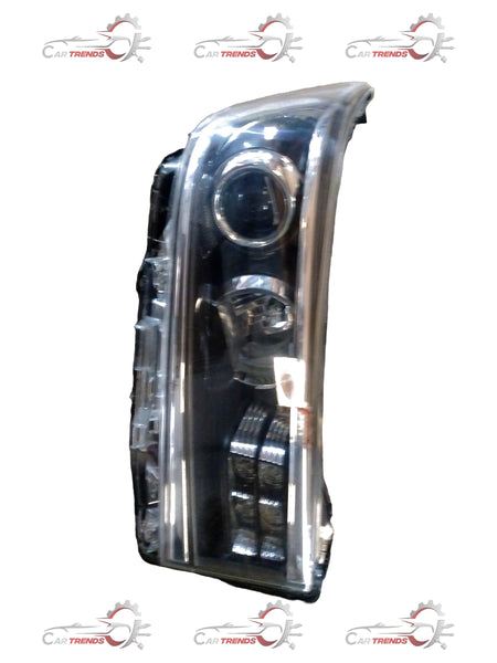Toyota Hilux and Fortuner headlamp unit assembly, showing the front view with clear lens and reflective interior components.