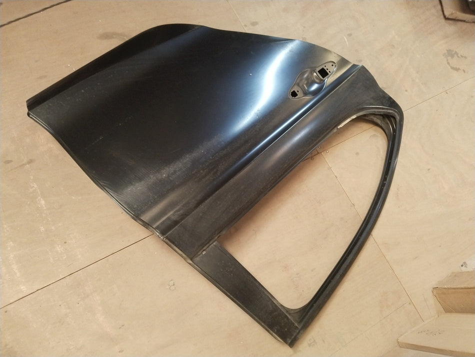 Honda City rear right door panel, complete with handle and window frame, in a natural gray finish.