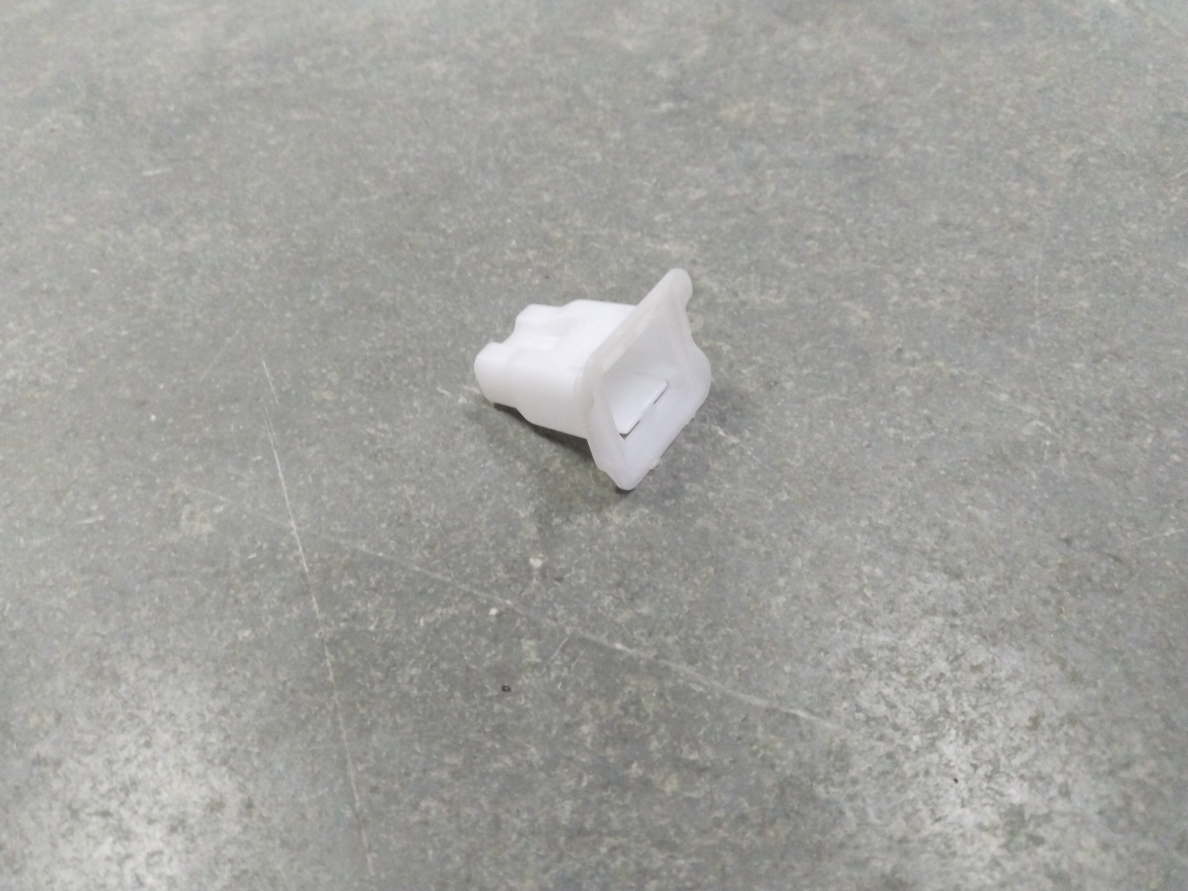 Suzuki A-Star cushion seat hook spare part by CarTrends, rear view showing the hook component for seat attachment.