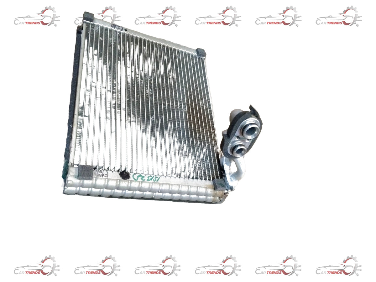 Maruti Suzuki evaporator assembly part 95411M83P00 showing metal and plastic components for vehicle air conditioning system.