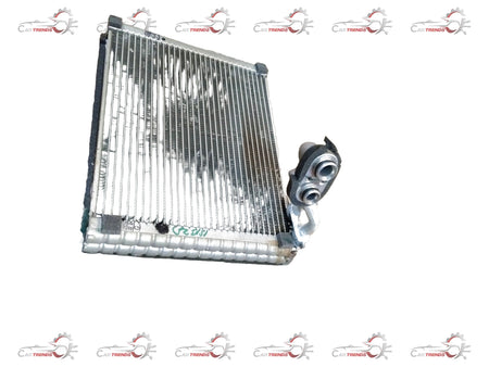 Maruti Suzuki evaporator assembly part 95411M83P00 showing metal and plastic components for vehicle air conditioning system.