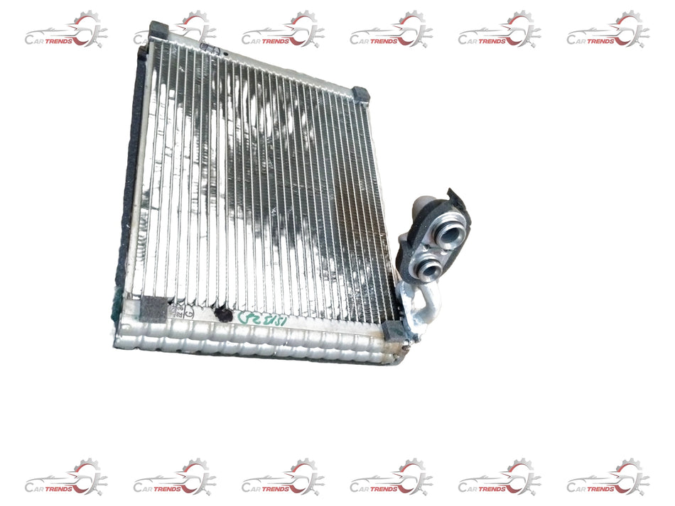 Maruti Suzuki cooling coil for Ertiga vehicle, showing metallic component with coil windings and connection points.