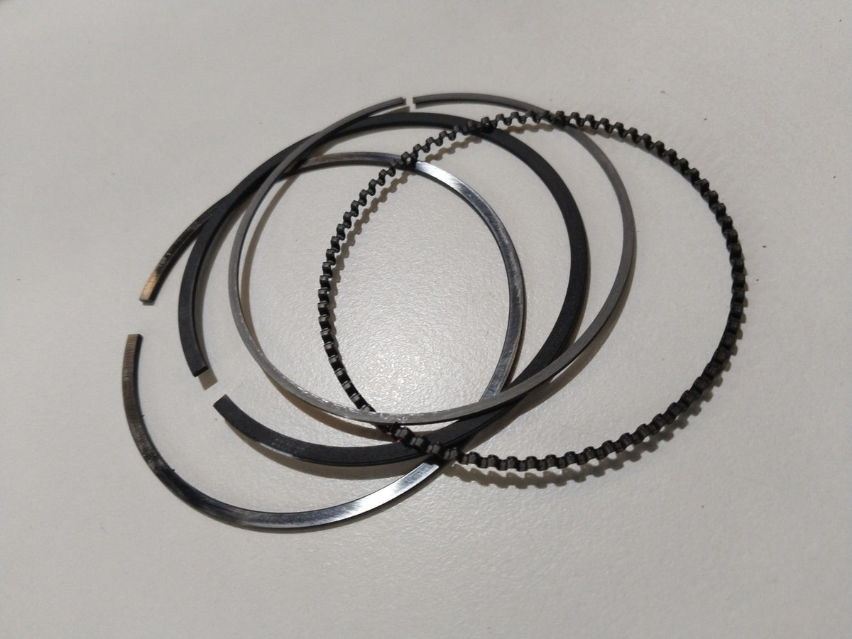 Maruti Suzuki piston ring set for WagonR, A-Star, and Estilo models, showing a close-up of the engine piston rings.