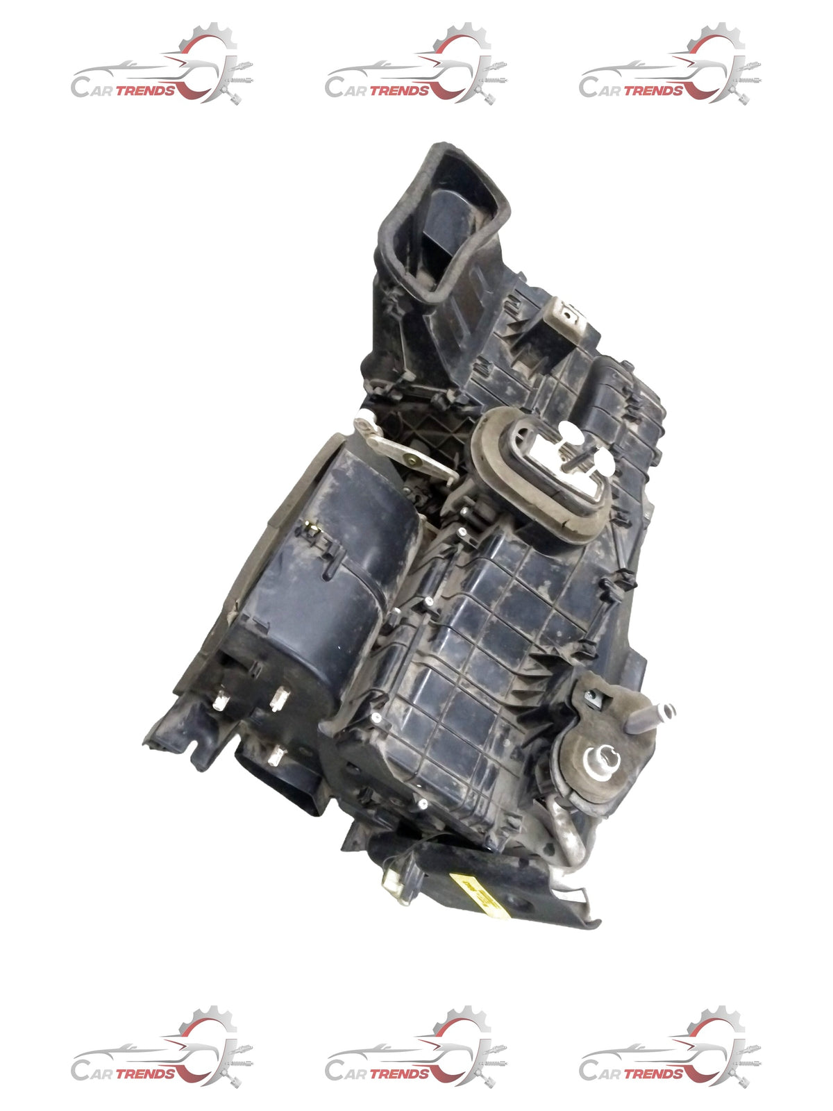 General Motors Chevrolet Beat air conditioning evaporator module assembly showing metal components and connectors.