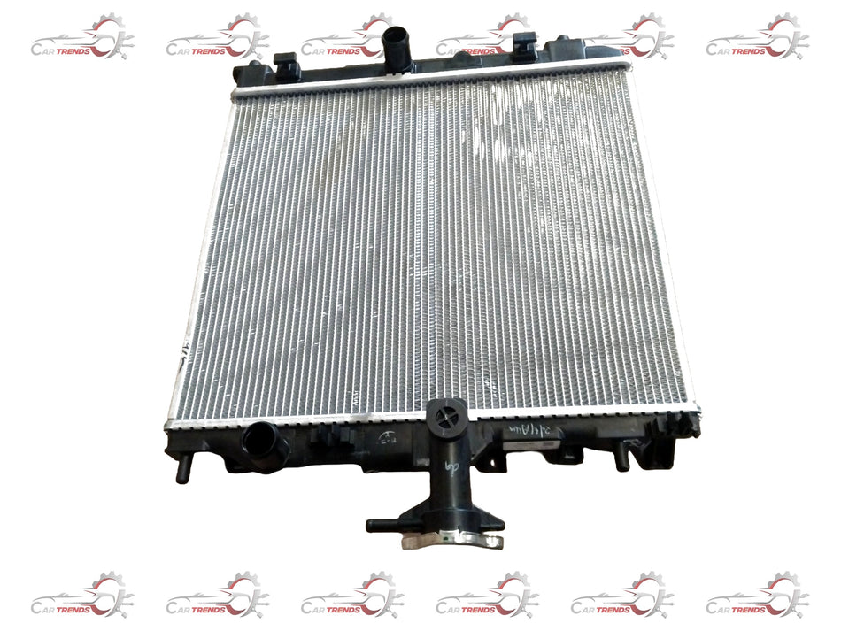Maruti Suzuki radiator for Celerio 1st Gen, Alto K10, WagonR, suitable for petrol and CNG engines, installed or displayed.
