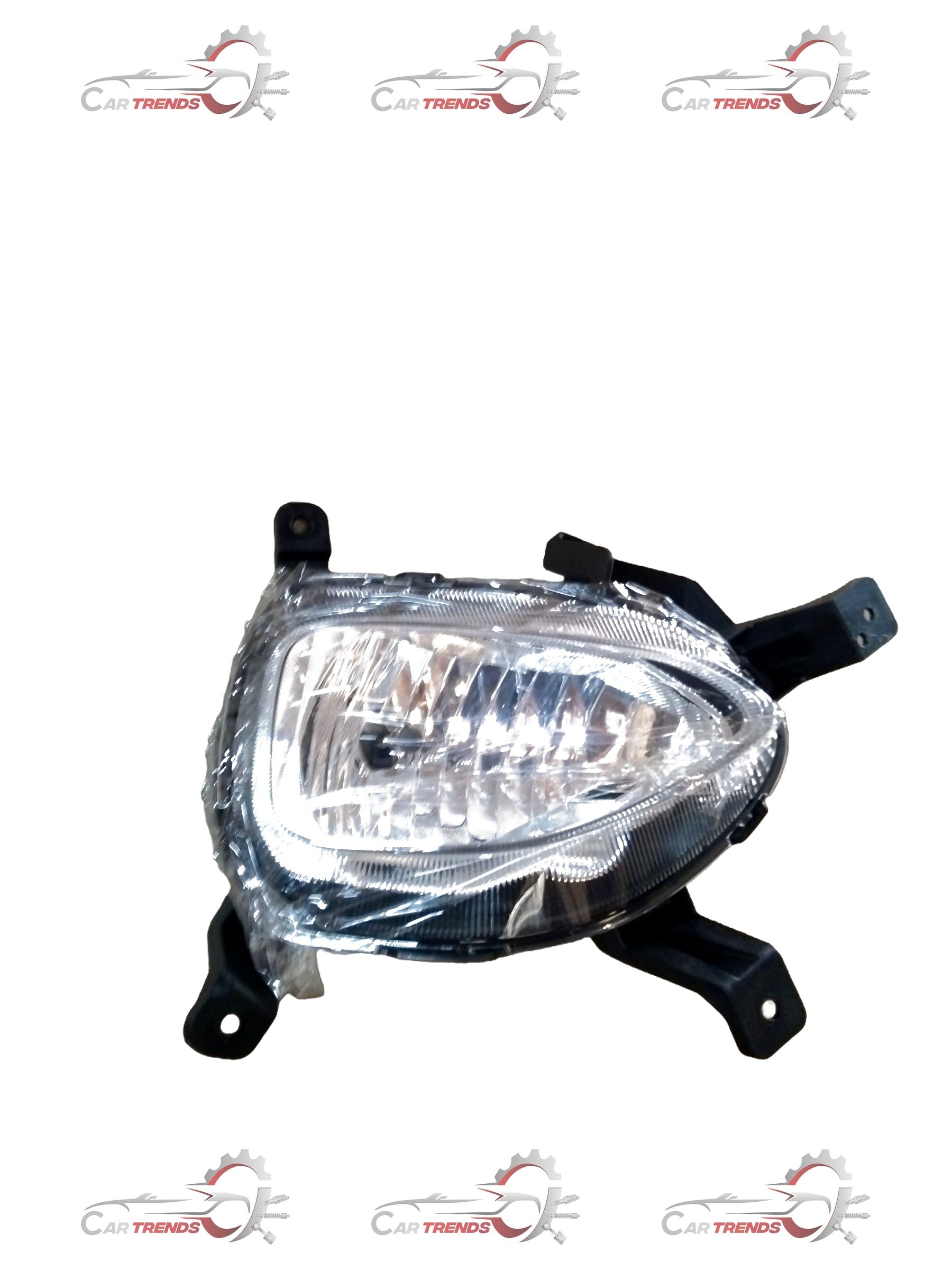 Hyundai I20 front fog lamp spare part by CarTrends, showing the clear lens and mounting bracket for vehicle lighting.