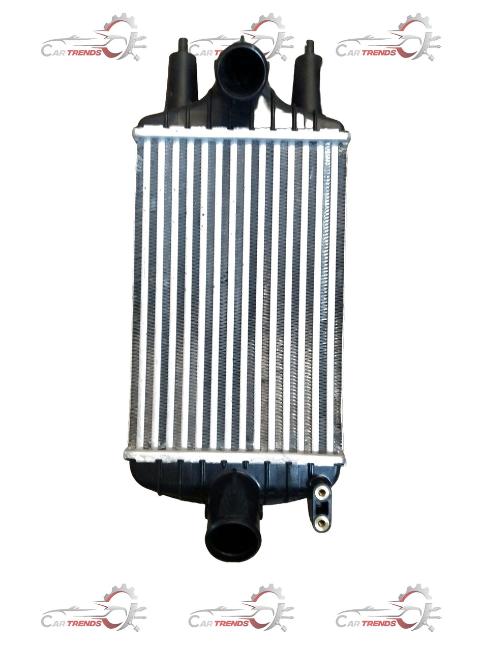 Maruti Suzuki Intercooler for WagonR vehicle, showing the metal core and mounting brackets in a detailed automotive image.