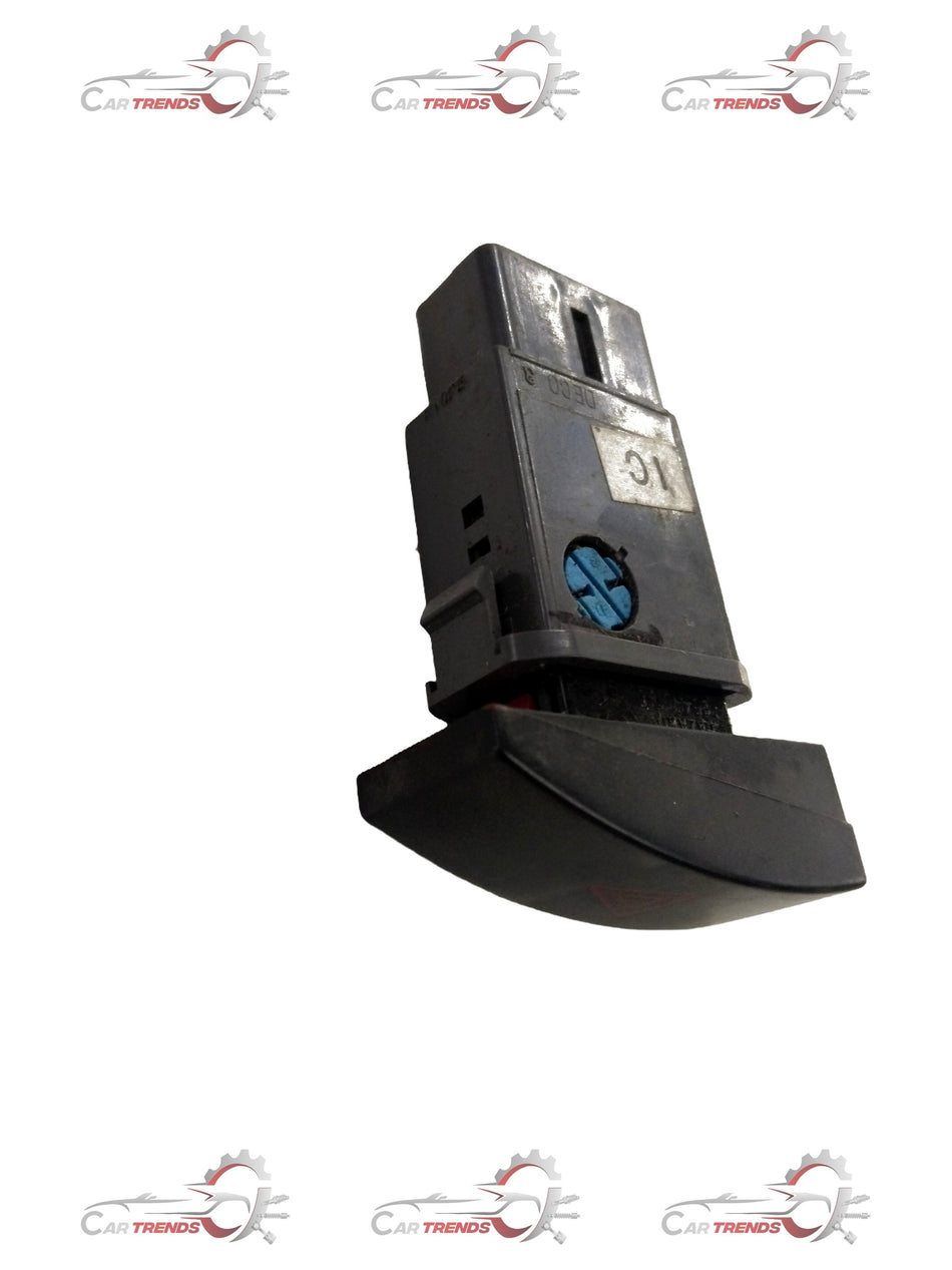 Chevrolet Optra hazard light switch from CarTrends, interior view showing the black switch with hazard symbols.