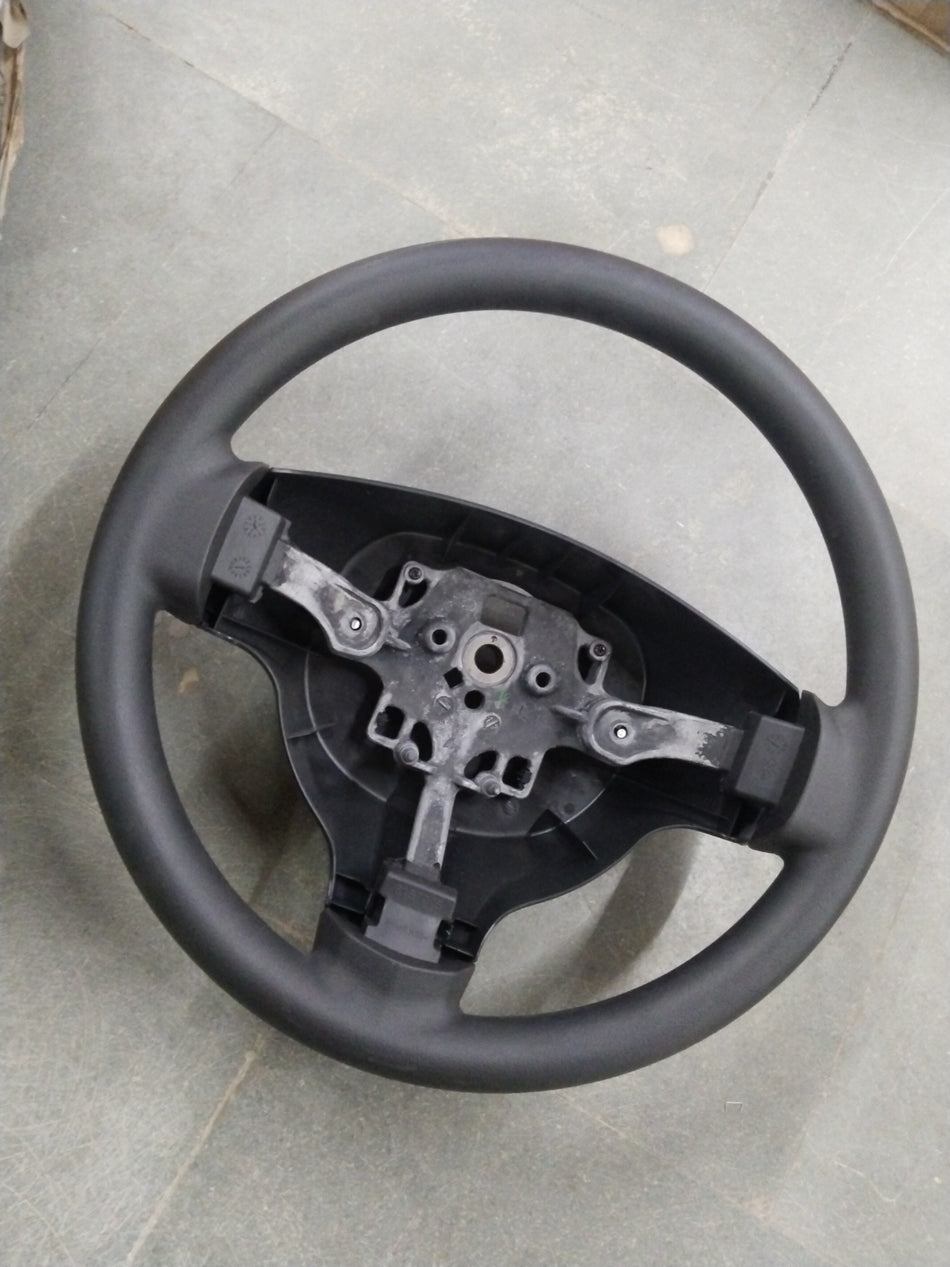 General Motors Chevrolet Enjoy steering wheel assembly, showing the black wheel and mounting components in a detailed image.