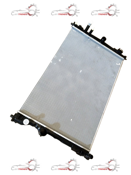 Toyota Invicto radiator assembly by CarTrends, showing the new radiator with mounting brackets and cooling fins.