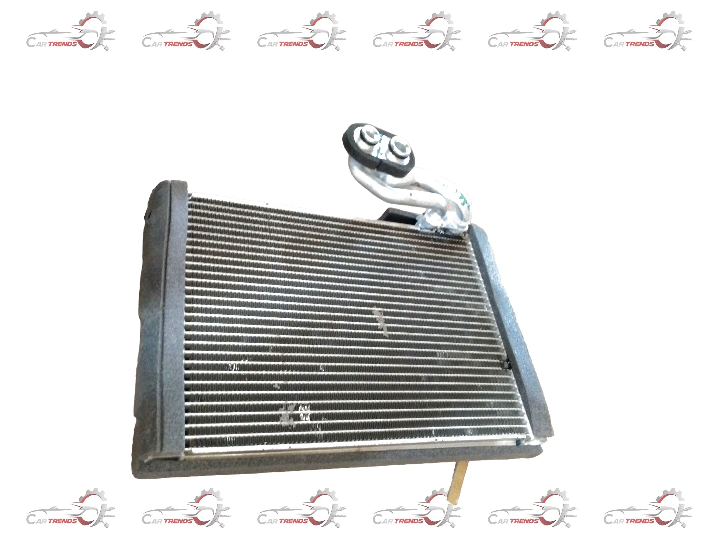 Maruti Suzuki EVAPORATOR SUB ASSY 95411M56R00 showing the automotive air conditioning component with metal fins and connectors.