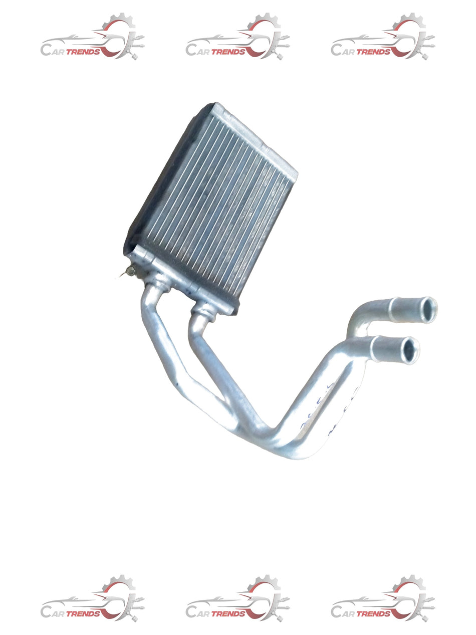 Maruti Suzuki S-Presso heater core, automotive replacement part, showing metal components and connectors for heating system repair.