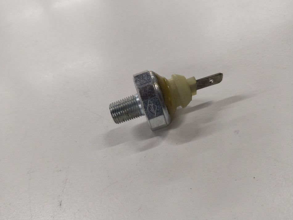 CarTrends Chevrolet Tavera switch oil pressure spare part, close-up view of the mechanical component for engine oil regulation.