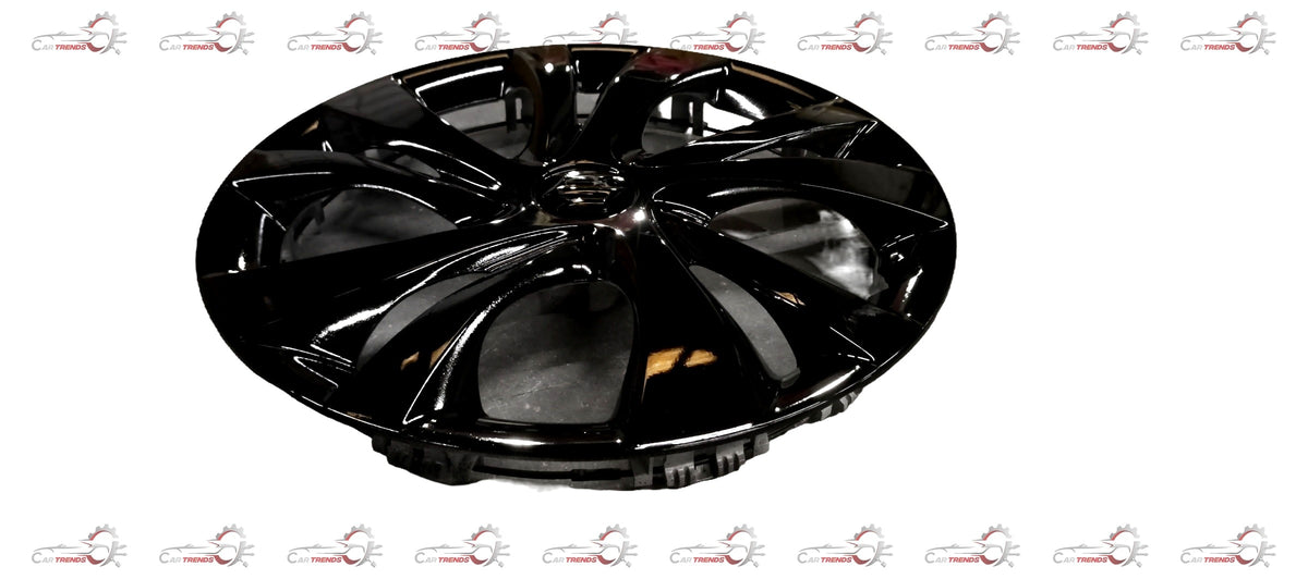 Black wheel cover for Maruti Suzuki vehicle, featuring a sleek design and durable material, installed on a car wheel.