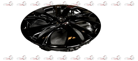 Black wheel cover for Maruti Suzuki vehicle, featuring a sleek design and durable material, installed on a car wheel.