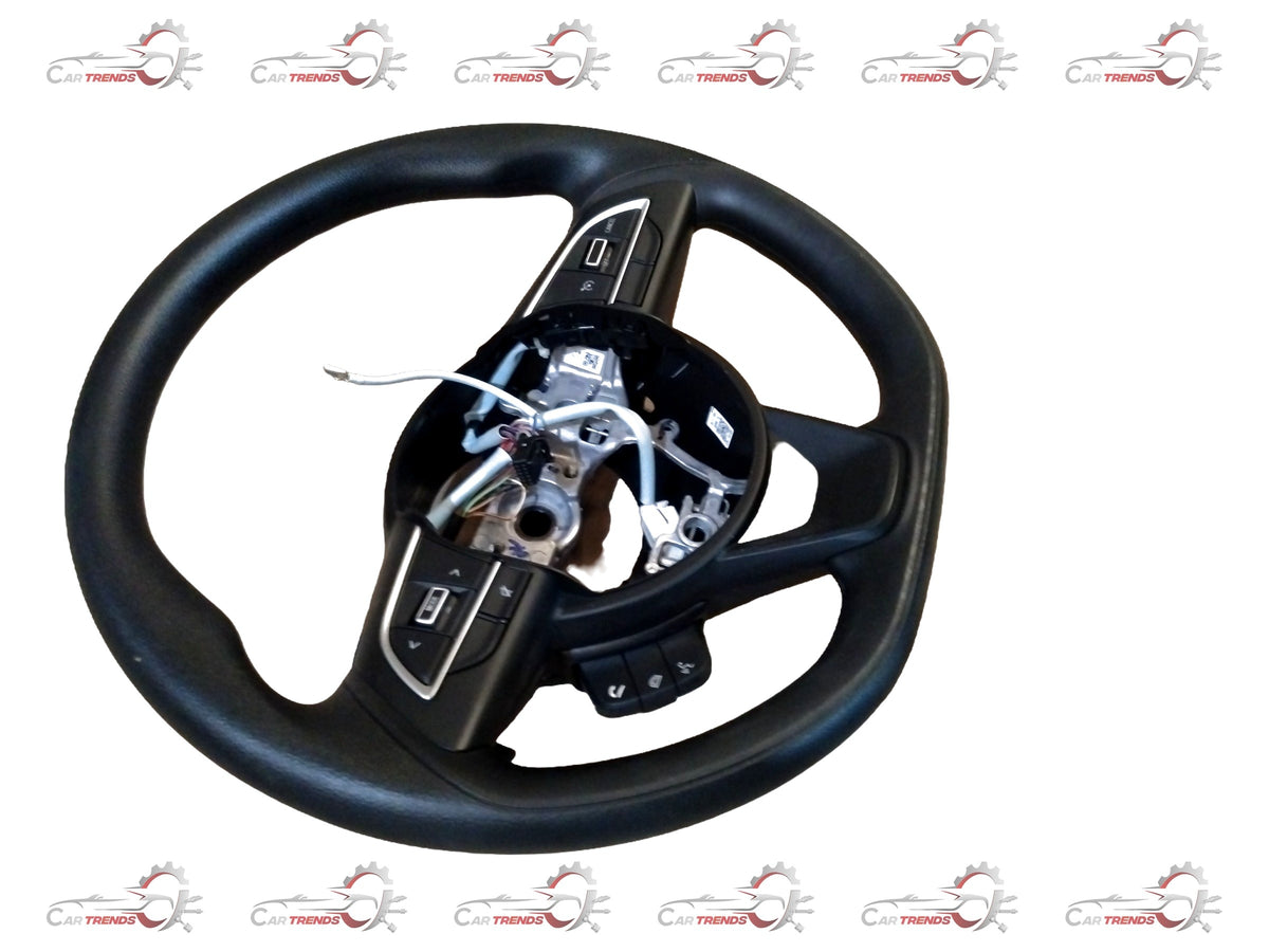 Maruti Suzuki XL6 or Brezza base model steering wheel with black and silver design, mounted on the vehicle's dashboard.