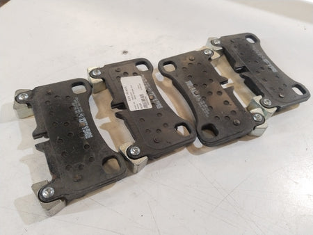 Front aftermarket brake pad for Audi Q7, showing the black friction surface and metal backing plate.