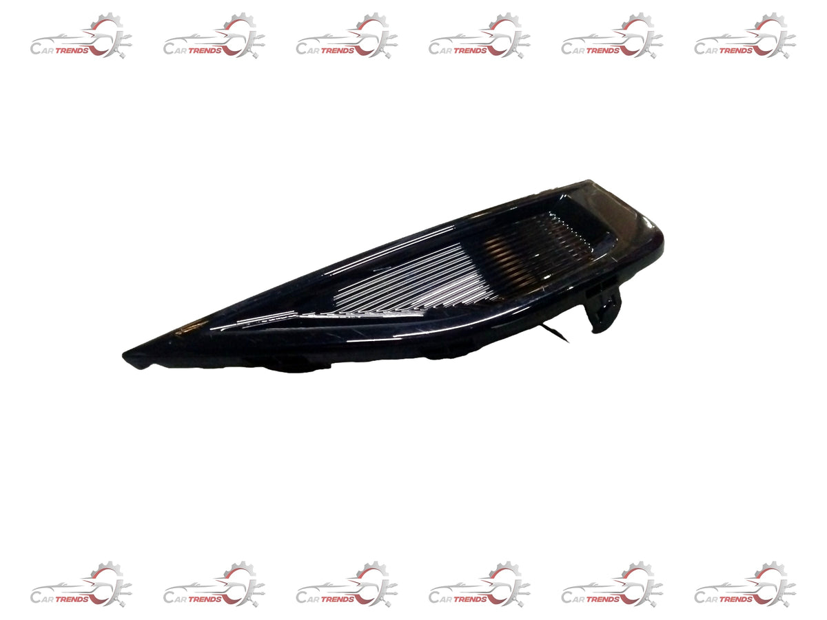 Front head lamp bezel for Maruti Suzuki, left side, close-up view showing the black plastic housing and mounting edges.