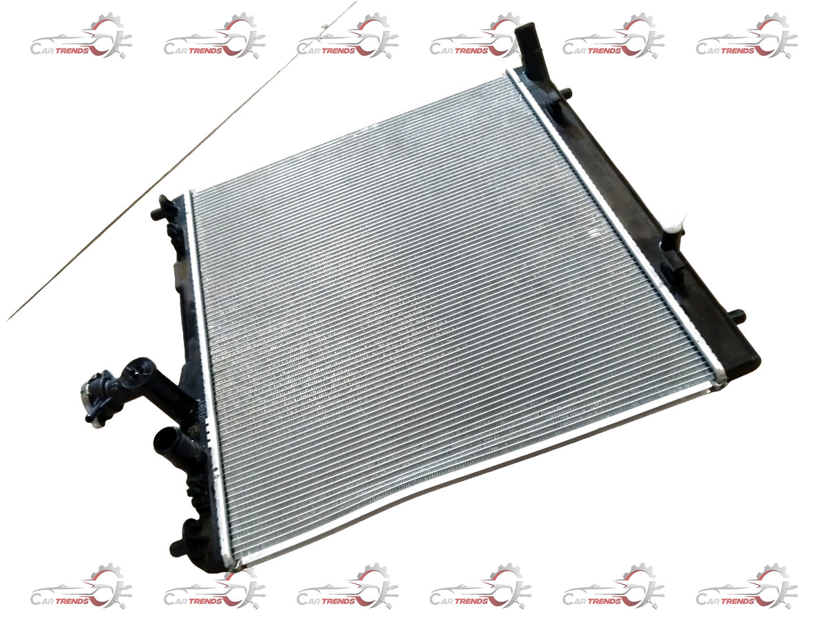 CarTrends Brezza 2nd Gen radiator for 2022+ petrol and CNG models, showing the metal core and inlet/outlet connections.