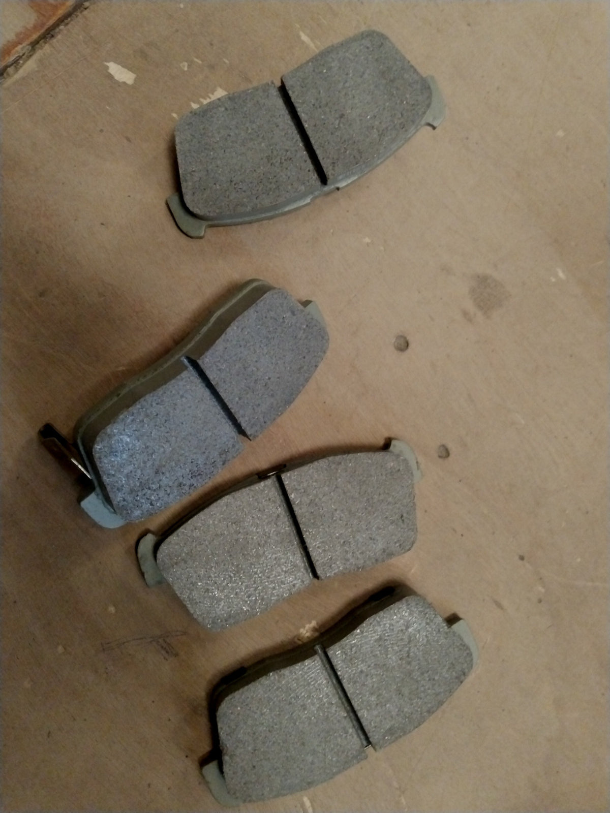 Front brake pad for Maruti Suzuki Eeco Facelift 2022+ showing the new replacement part with brake lining and metal backing.