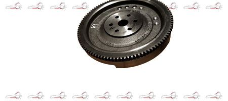 Maruti Suzuki flywheel showing metal gear and mounting surface for automotive engine connection
