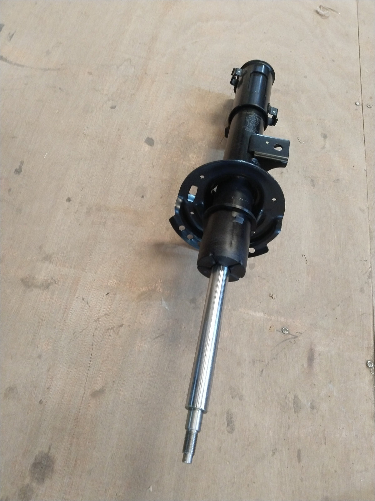 Hyundai Creta front left shock absorber, part #54651A0100, showing the metal and rubber components of the suspension part.