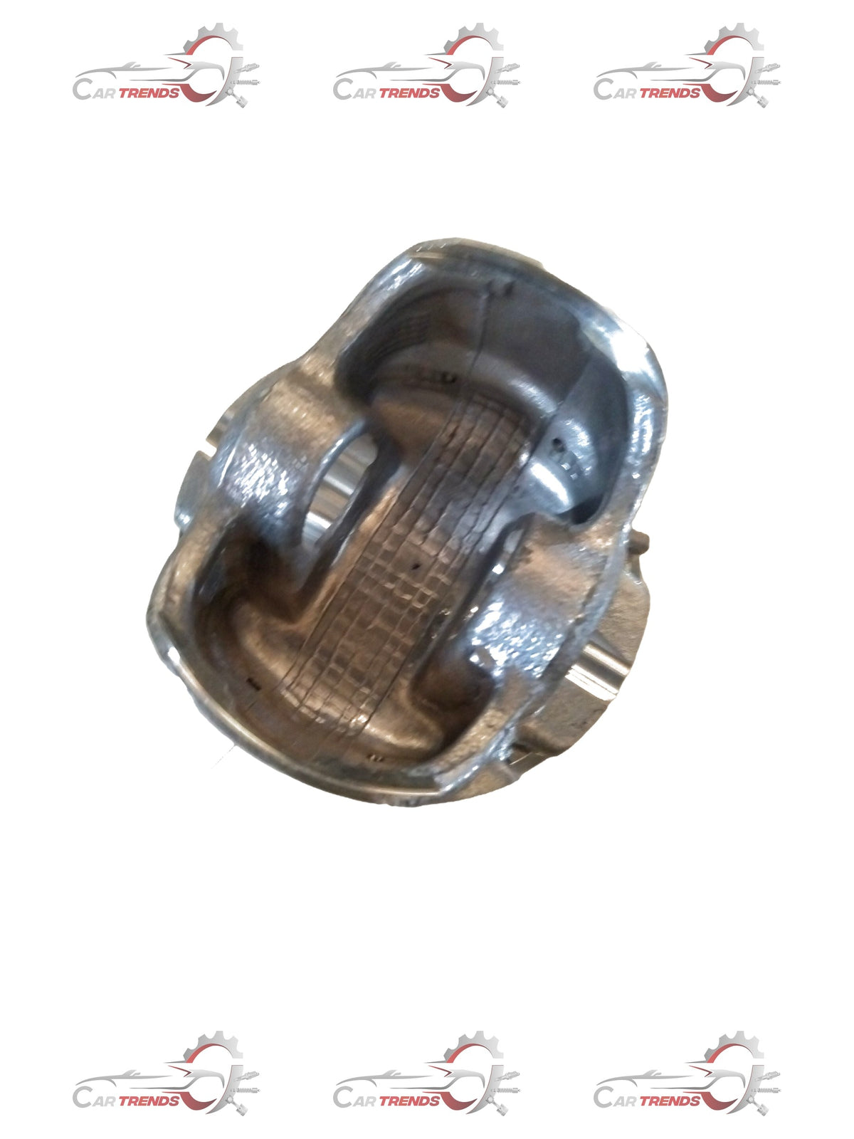 Maruti Suzuki piston for Baleno, Ignis, Swift, and Dzire engines, showing the metal piston with detailed surface texture.