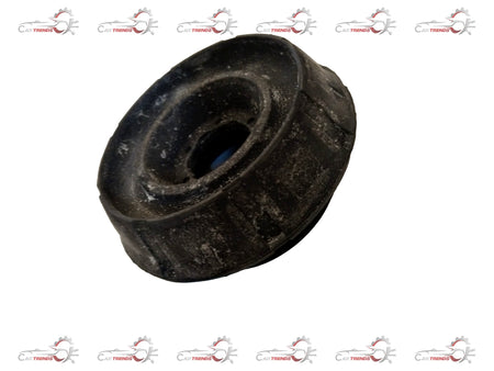 Nissan suspension strut for Mahindra Everito, showing the coil spring and mounting components in a close-up image.