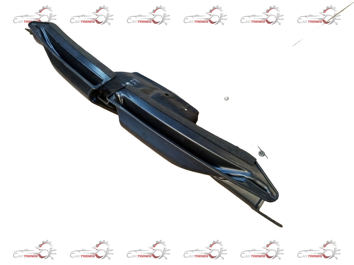 Nissan defroster washer nozzle by CarTrends, showing the black plastic component with mounting points and spray openings.