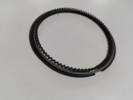 Maruti Suzuki piston ring set for Wagon R, A-Star, Estilo models, showing metal rings with branding and product details.