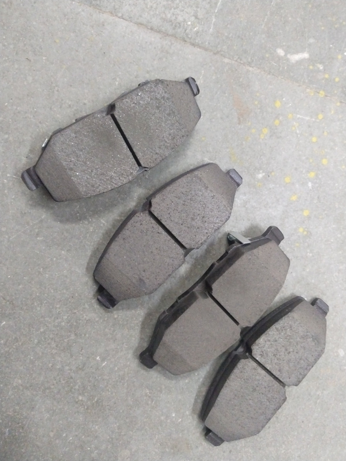 CarTrends Altroz DSL/Nexon EV front brake pad set with basalt material, showing the new brake pads with detailed friction surface.