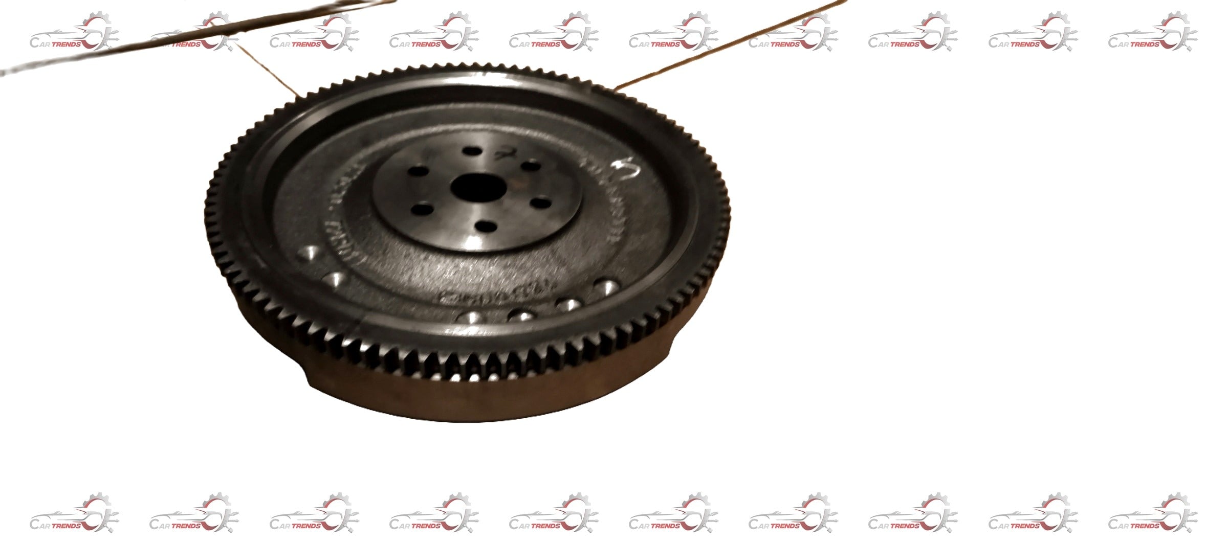 Maruti Suzuki flywheel component showing metal gear and clutch interface for vehicle engine connection