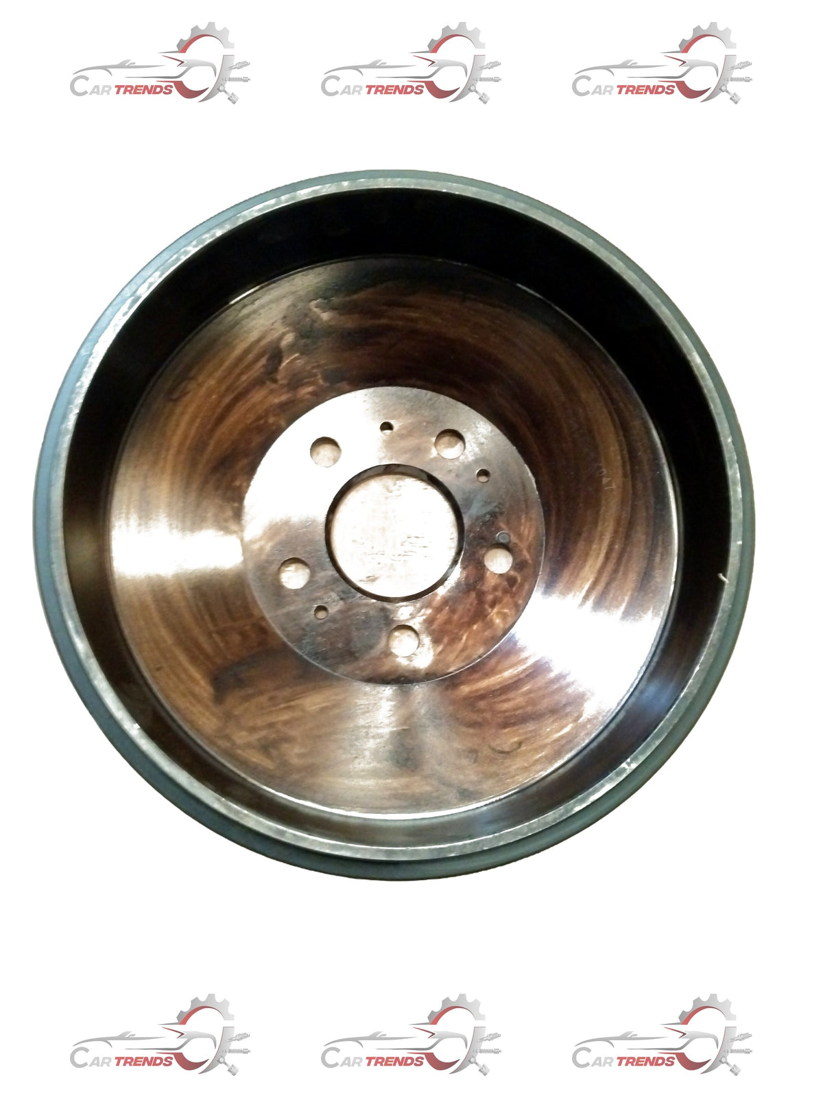 Mahindra rear drum brake assembly showing the metal drum and brake components in a close-up view.