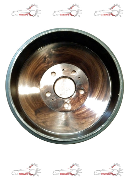 Mahindra rear drum brake assembly showing the metal drum and brake components in a close-up view.