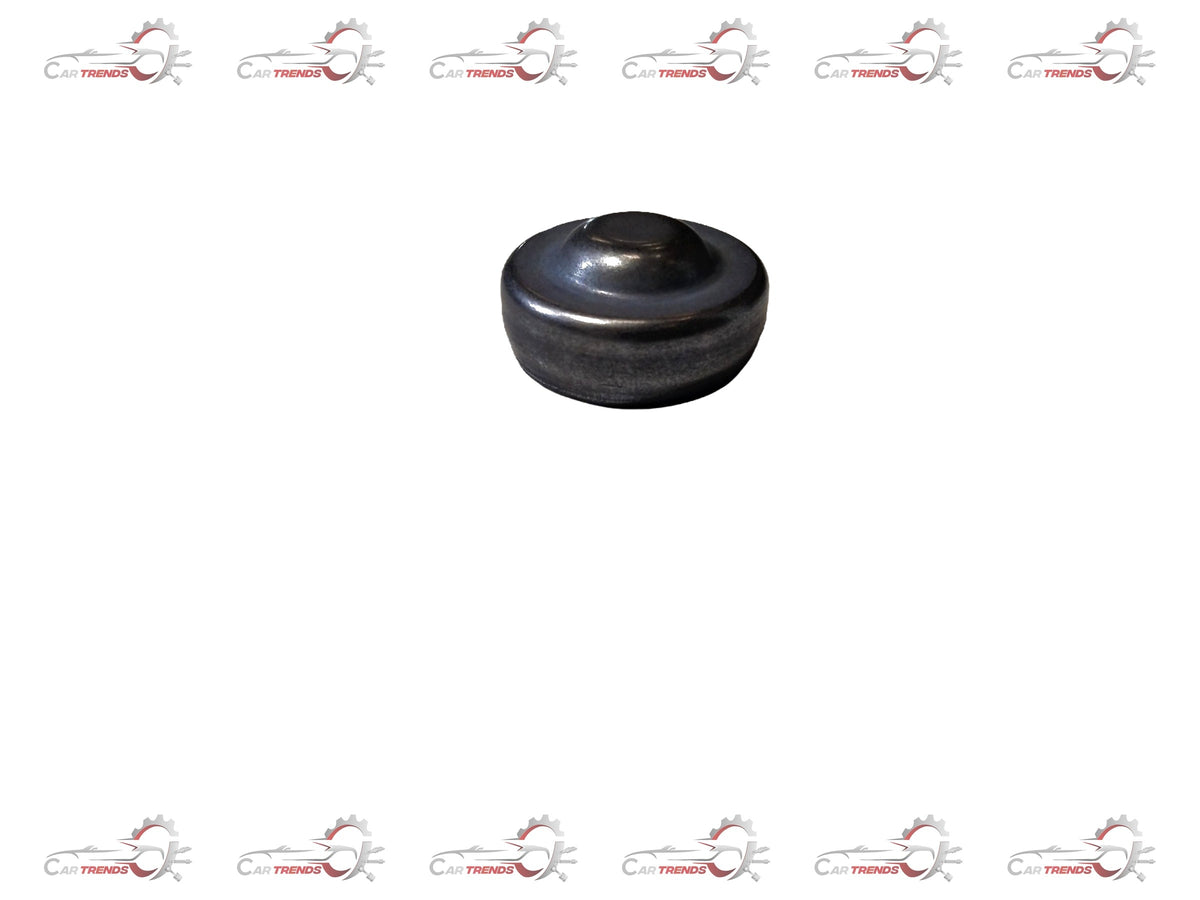 Ford engine plug, part #1225841, close-up of black plastic engine oil drain plug for Ford vehicles.
