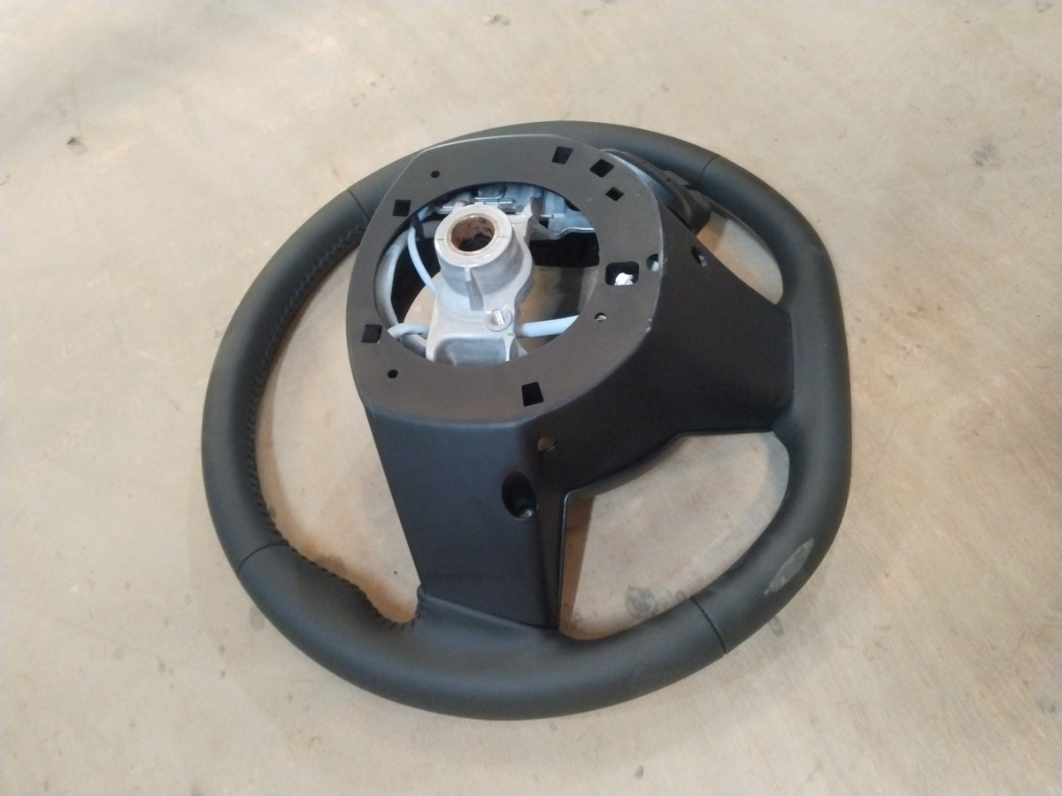 Maruti Suzuki Brezza 2nd Gen steering wheel for petrol and CNG models, showing the black automotive interior component.
