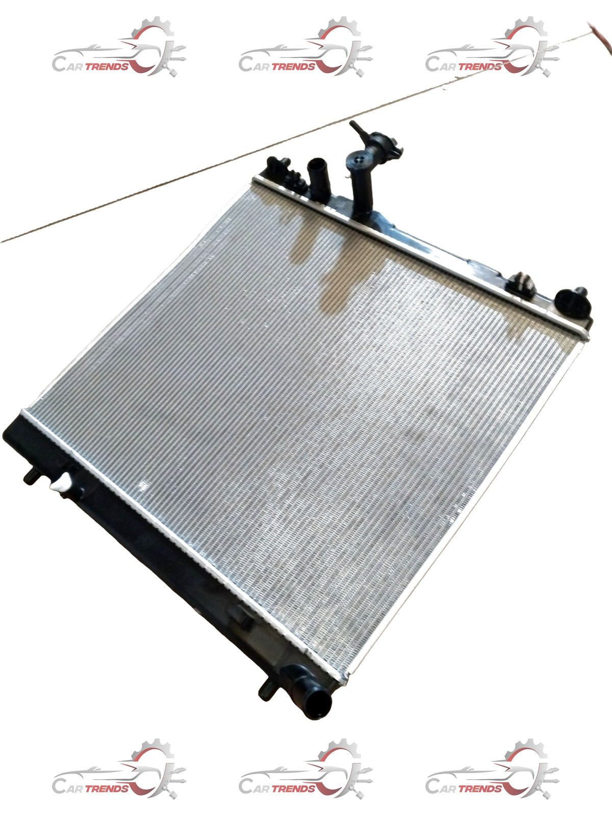 CarTrends Brezza 2nd Gen radiator for 2022+ petrol and CNG models, showing the metal core and mounting brackets.