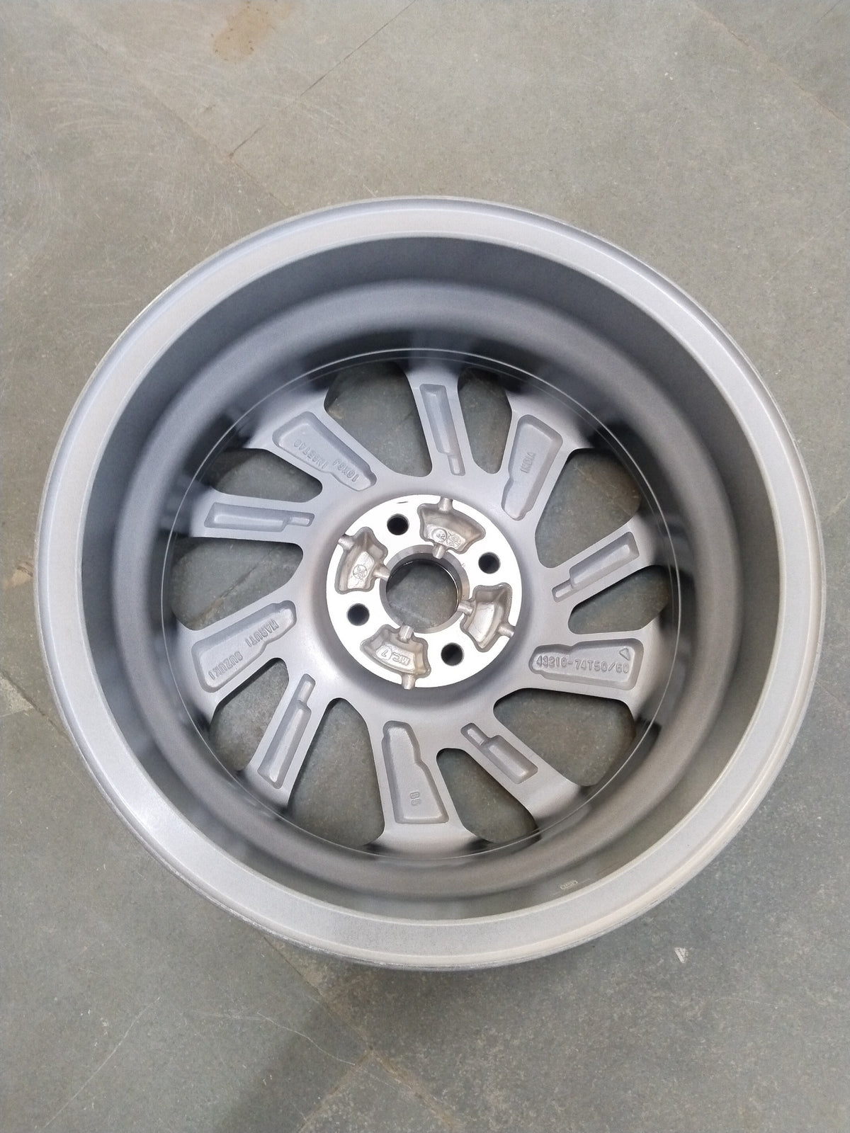 Maruti Suzuki alloy wheel with machined finish for Maruti Fronx, showing close-up of the stylish, polished wheel design.