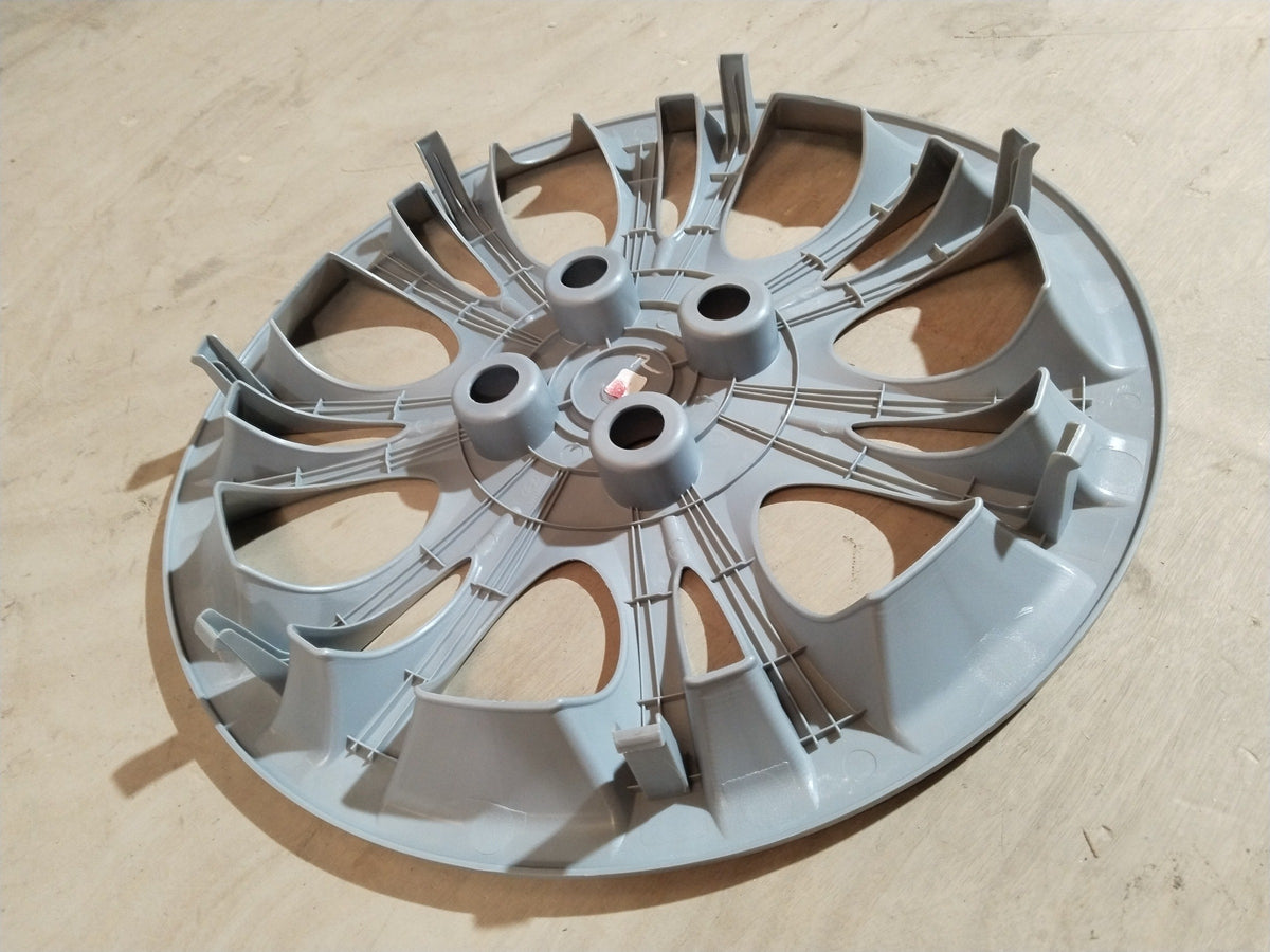 CarTrends wheel cap assembly for Hyundai I10, Grand I10, Xcent, I20 with a sleek design, shown in a close-up view.