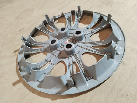 CarTrends wheel cap assembly for Hyundai I10, Grand I10, Xcent, I20 with a sleek design, shown in a close-up view.